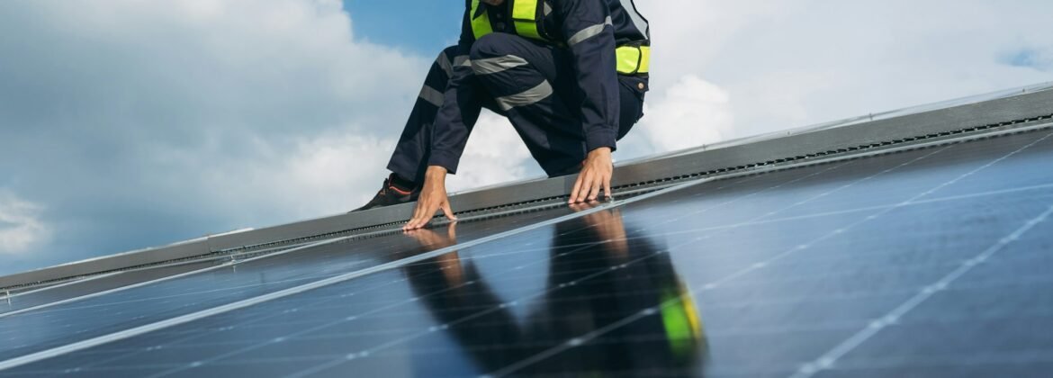 Service engineer checking solar cell on the roof for maintenance if there is a damaged part.