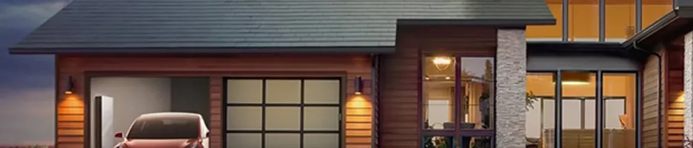a-home-pictured-with-tesla-s-solar-roof-a-car-and-new-powerwall-battery-as-the-sun-falls